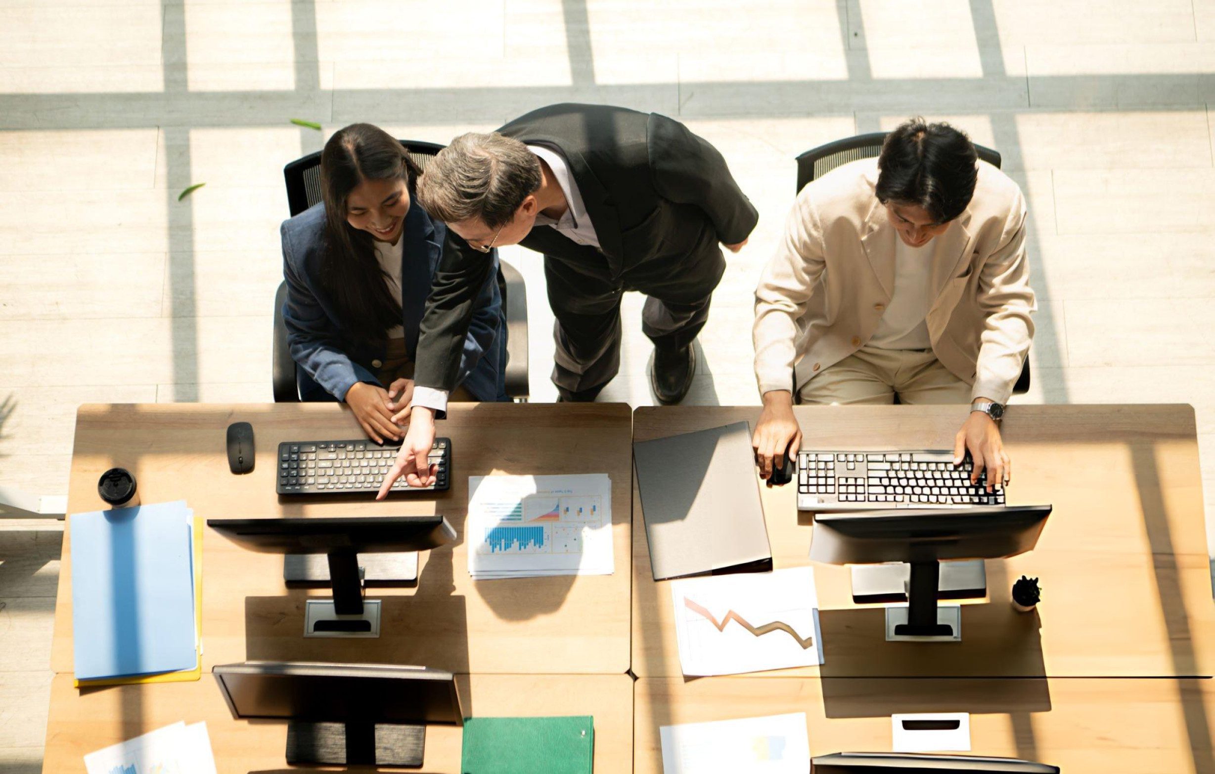 business-colleagues-working-together-at-computers